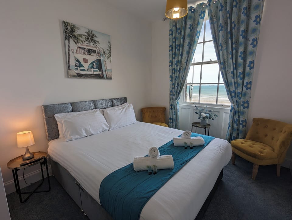 Double Room, Beach View, Beachfront | Desk, laptop workspace, blackout drapes, iron/ironing board