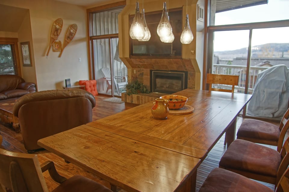 The dining area adjoins the living room and deck