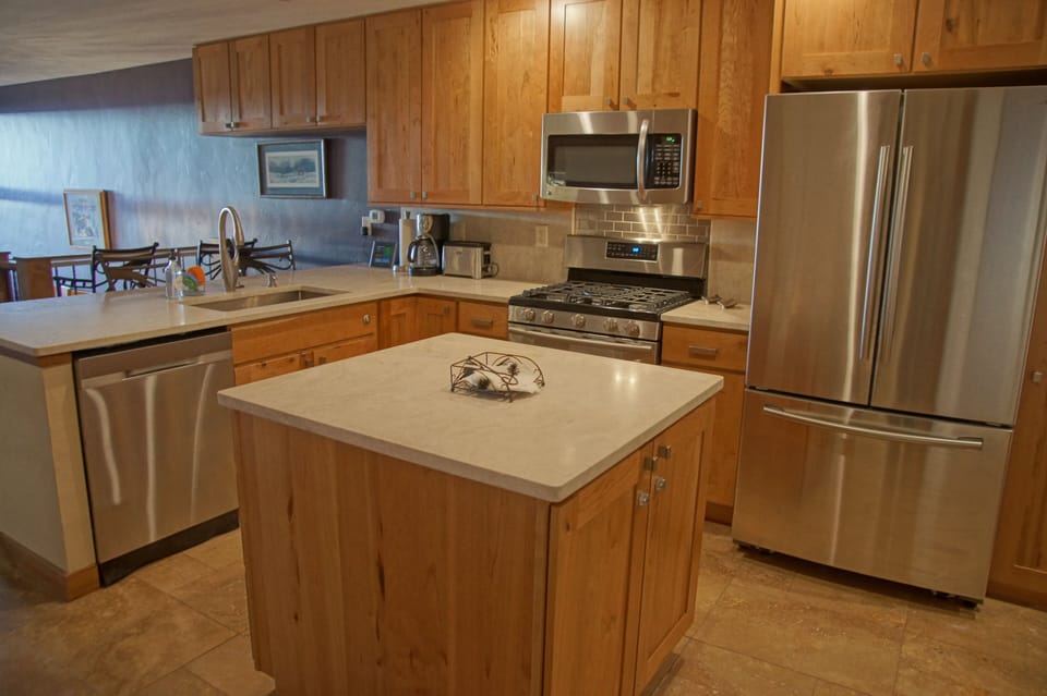 A large island in a kitchen with great flow