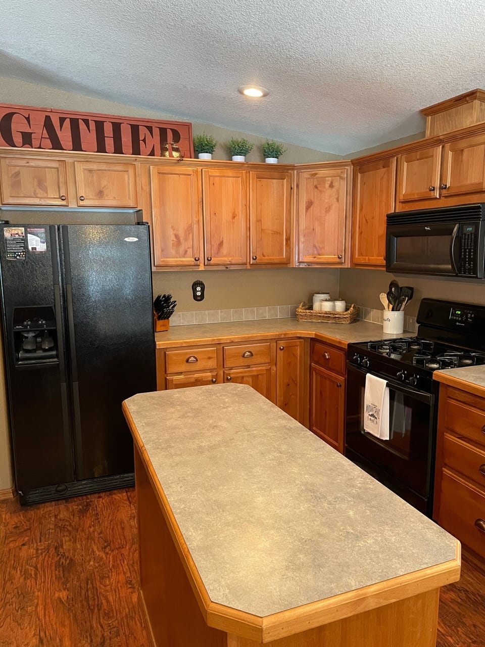 Plenty of counter top space for preparing meals  together.  
