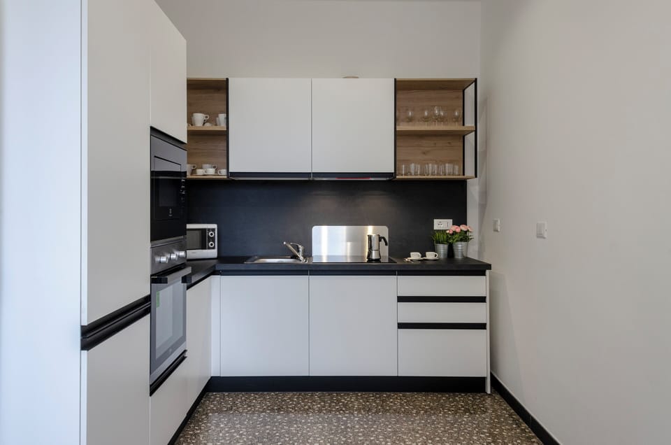 Apartment (3 Bedrooms) | Private kitchen | Fridge, microwave, oven, stovetop