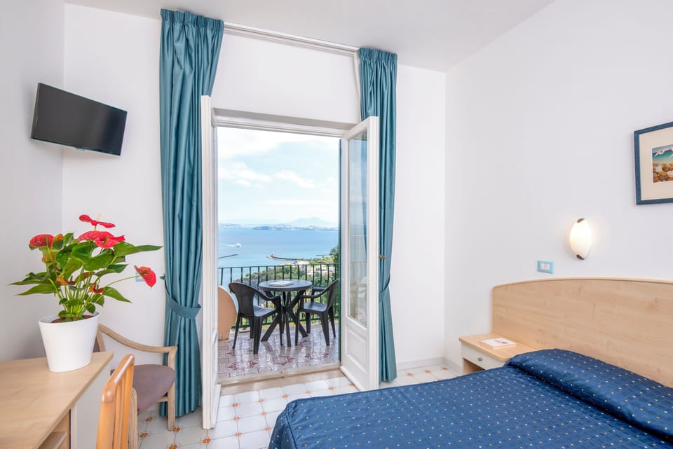 Superior Double Room, Balcony, Sea View | Minibar, in-room safe, desk, travel crib