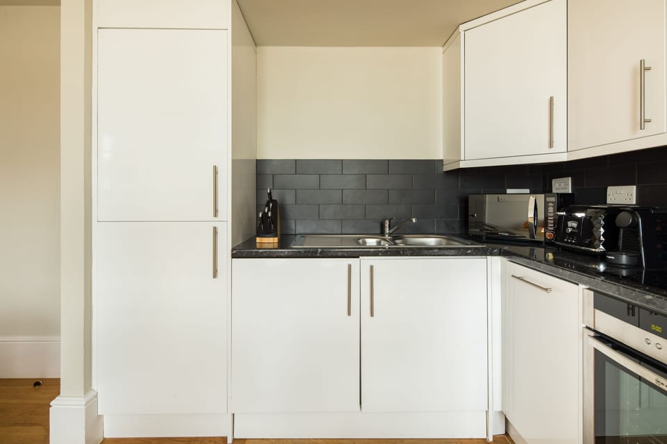 Suite, 1 Bedroom | Private kitchen | Fridge, microwave, oven, stovetop