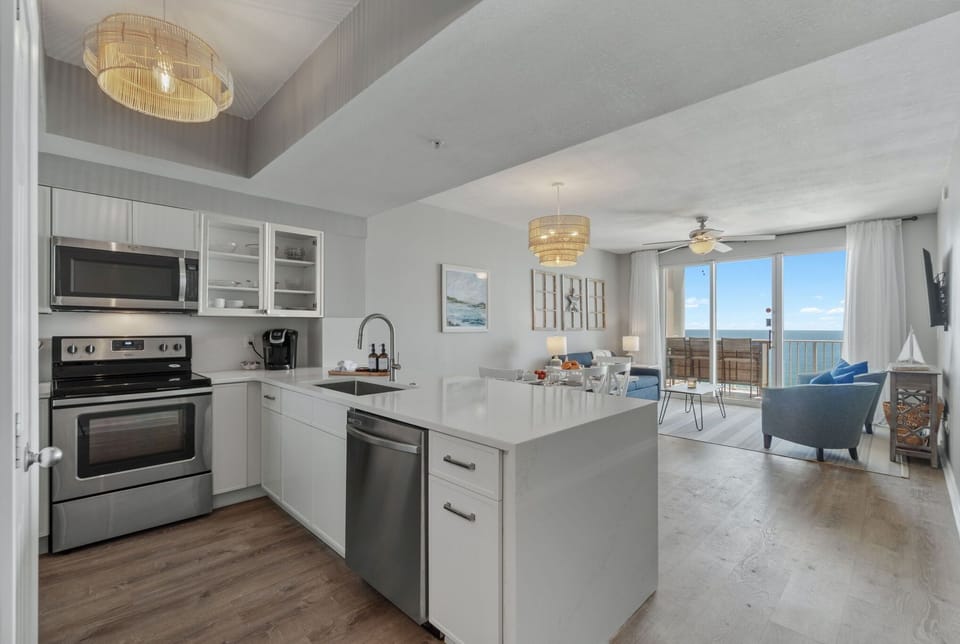 Updated kitchen with quartz counters & new fridge—style meets convenience.