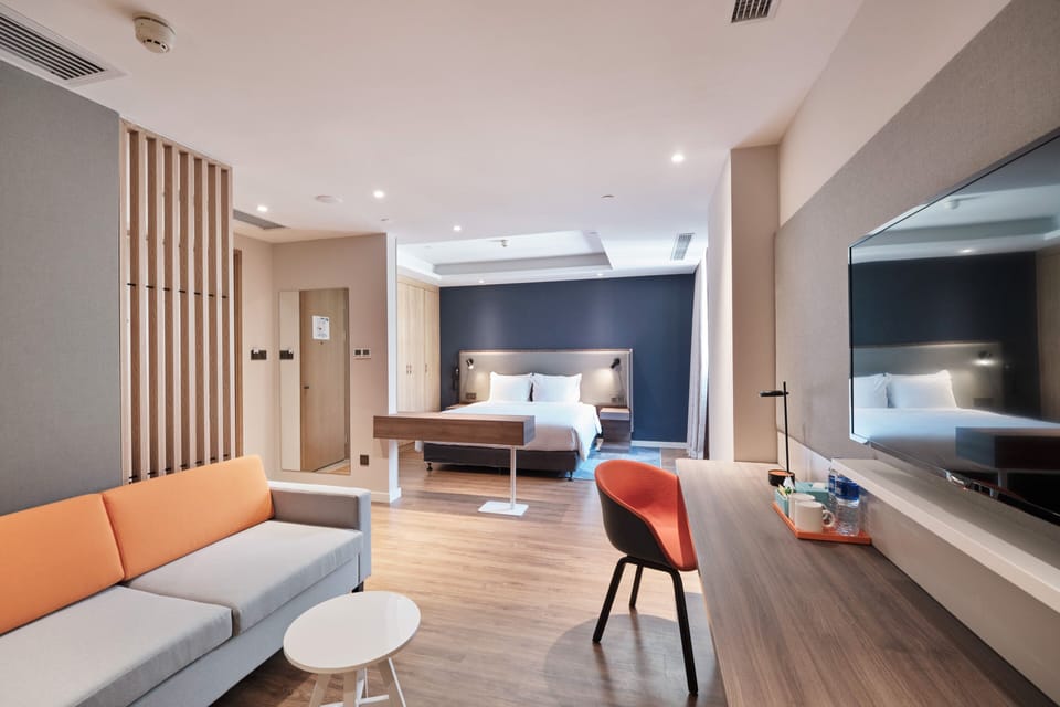 Suite, 1 King Bed | In-room safe, soundproofing, iron/ironing board, free WiFi