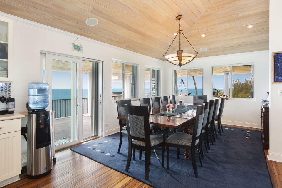 The dining room seats 12 comfortably (plus 4 more on the adjacent kitchen island) and also has beautiful ocean views.