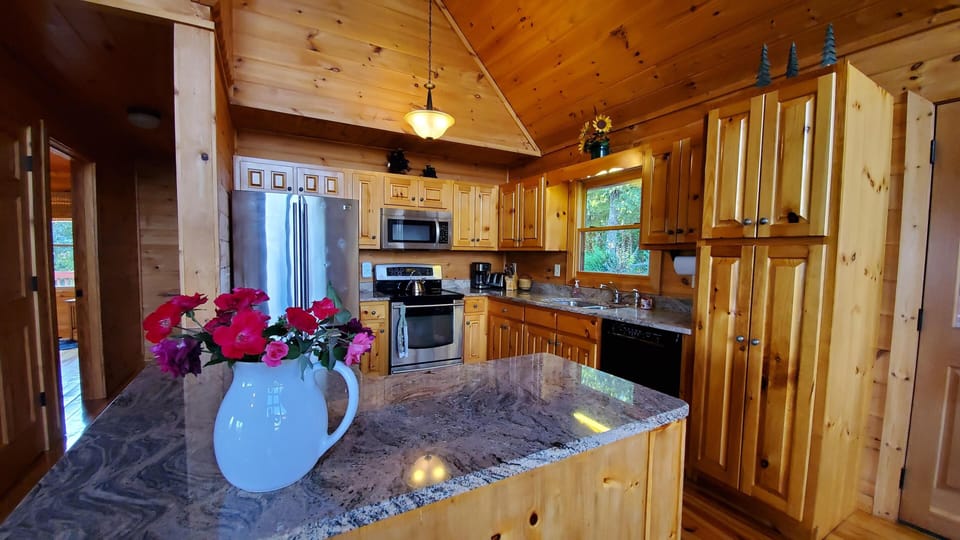 Well equipped, upscale kitchen with granite counter tops and stainless appliances