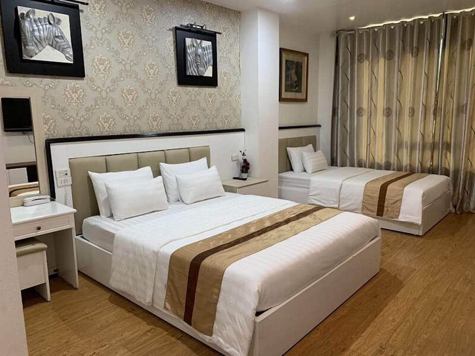 Family Room | Minibar, desk, blackout drapes, free WiFi