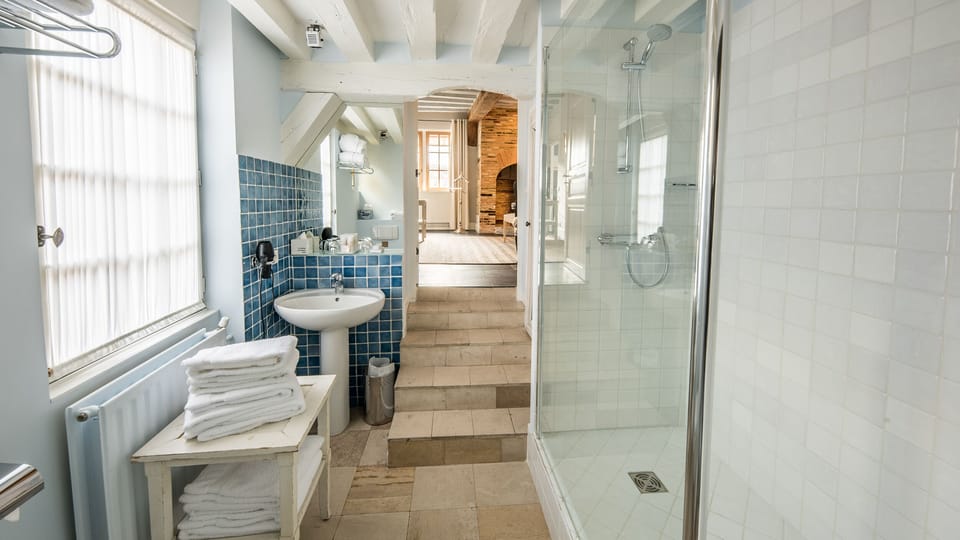 Family Suite | Bathroom | Hair dryer, bathrobes, towels, soap