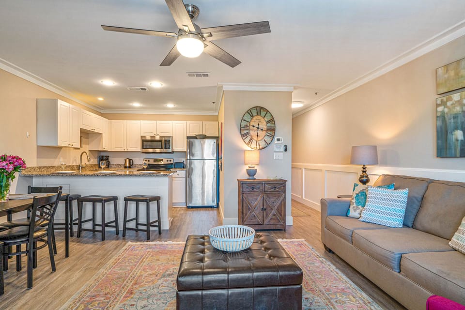 Open floor plan, fully stocked kitchen with seating at counter.