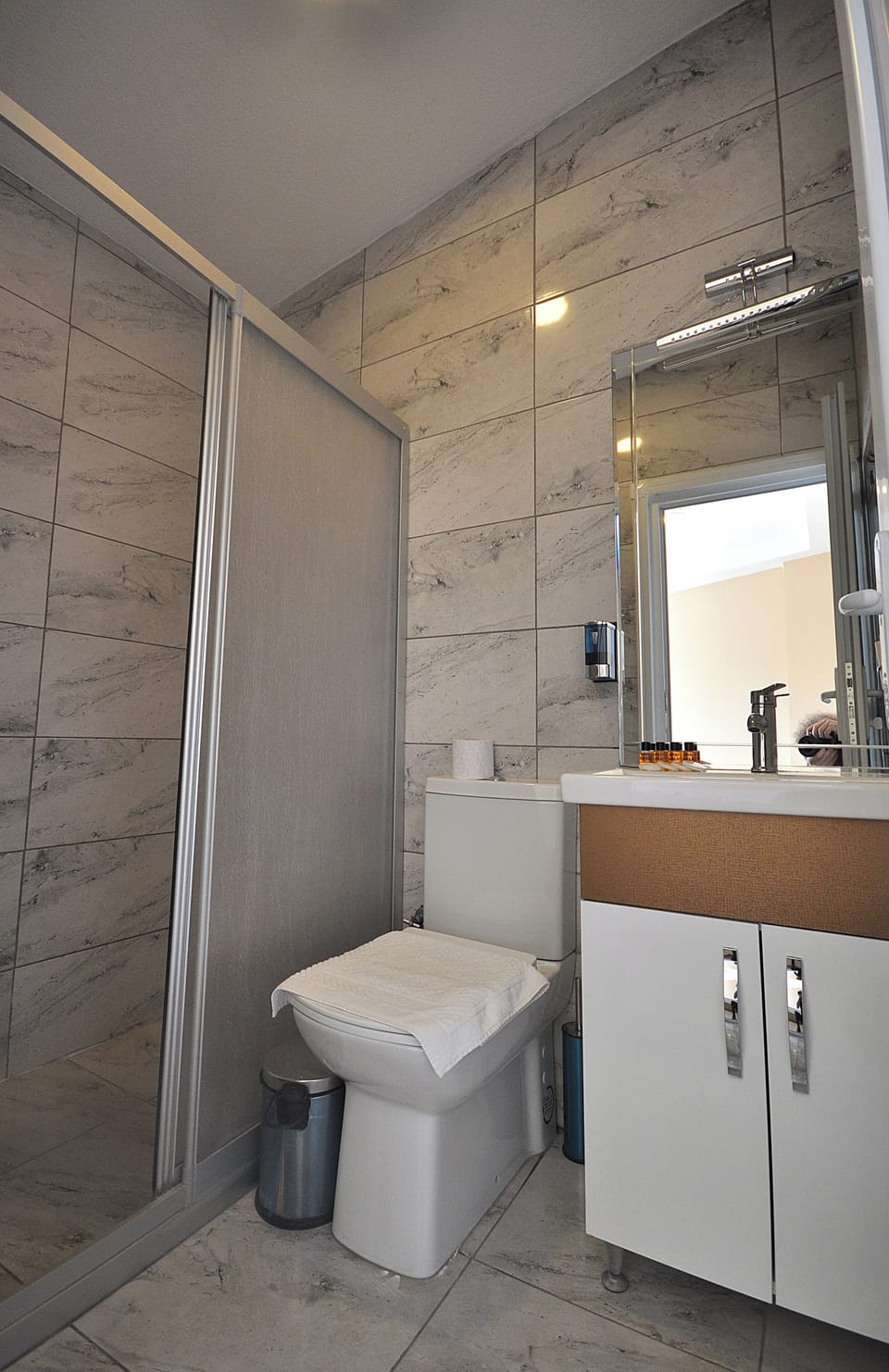 Shower, free toiletries, hair dryer, slippers