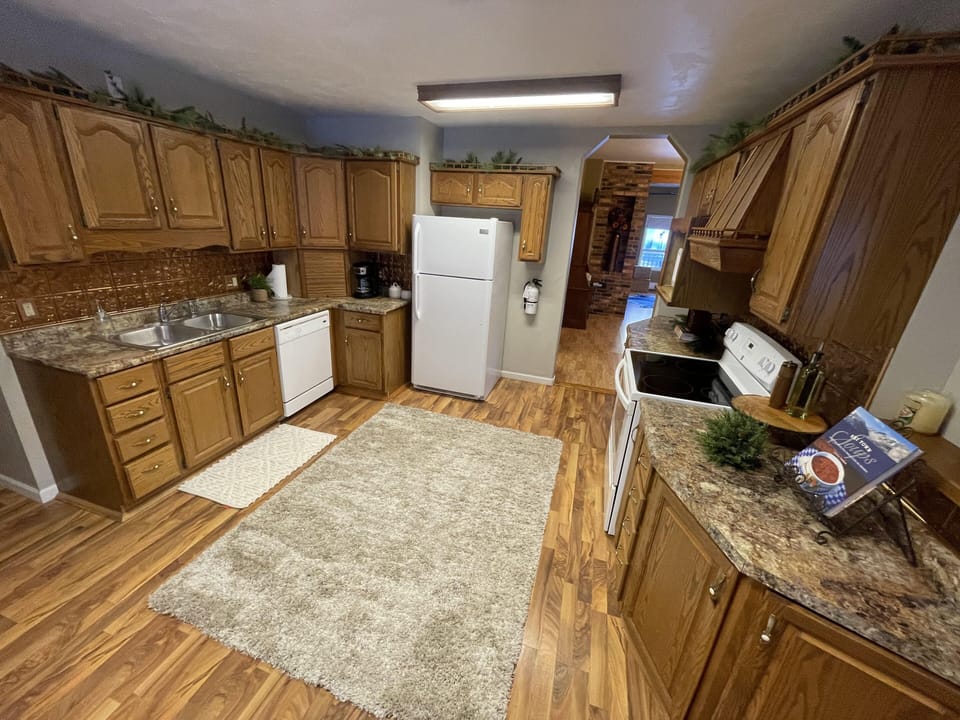 Kitchen With Microwave, Stove, Refrigerator & Dishwasher
