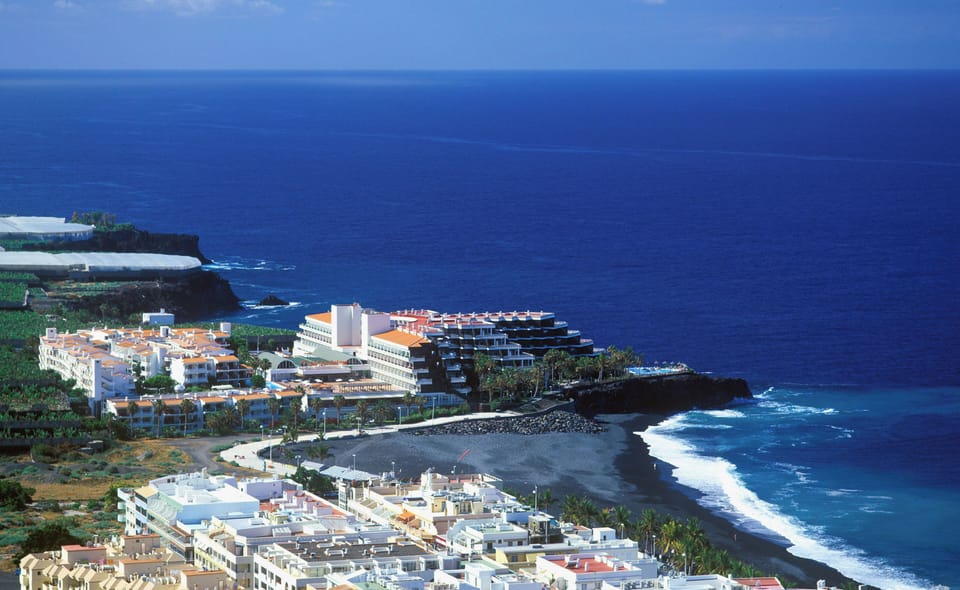On the beach, black sand