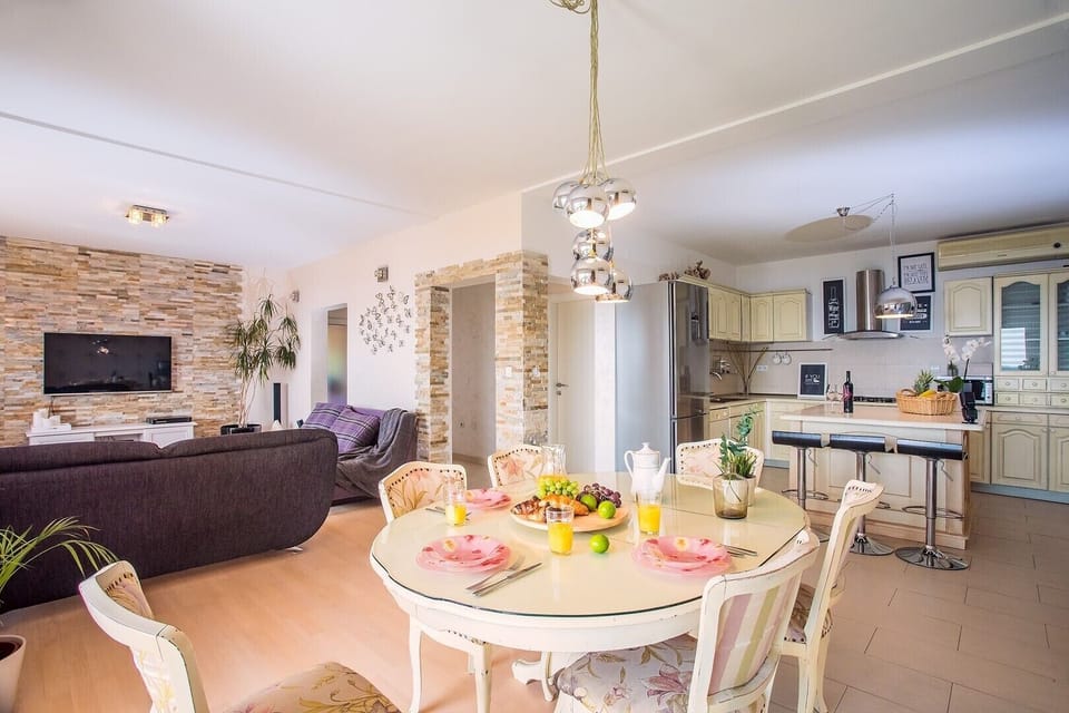 The first-floor offers an air-conditioned living and dining room with a kitchen