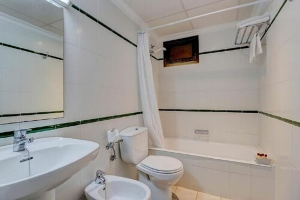 Bathtub, hair dryer, towels, soap