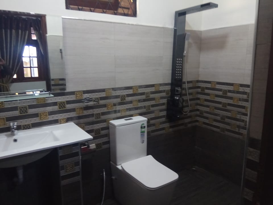 Shower, rainfall showerhead, slippers, towels