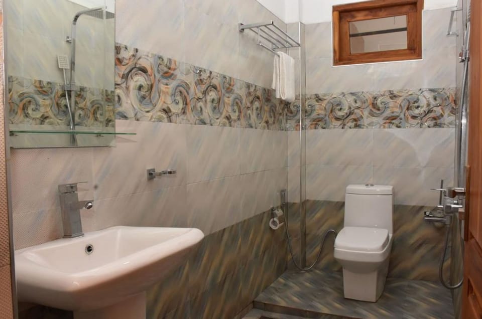 Family Room | Bathroom | Shower, rainfall showerhead, slippers, towels