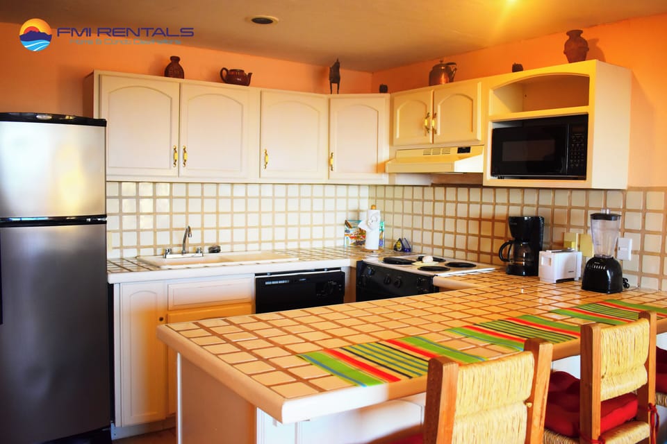 Kitchen equipped with basic cooking utensils
