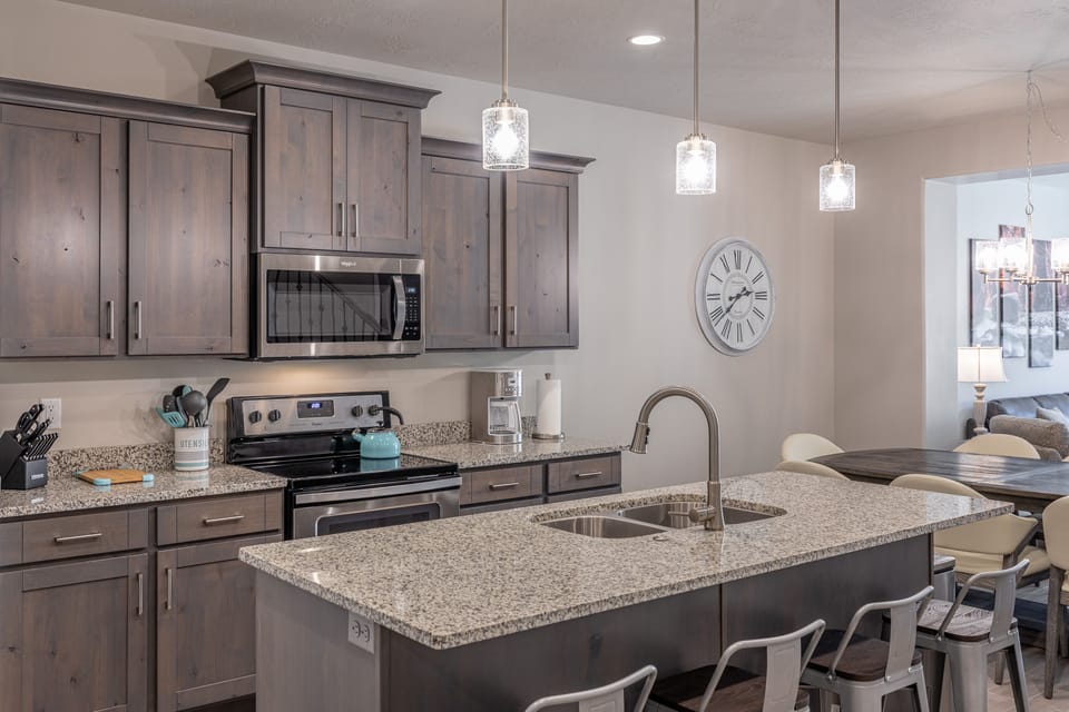 Kitchen - The Kitchen is complete with everything you will need for meal preparations including pots, pans, baking dishes, plates, cups, silverware, cutlery, and an assortment of cooking utensils.