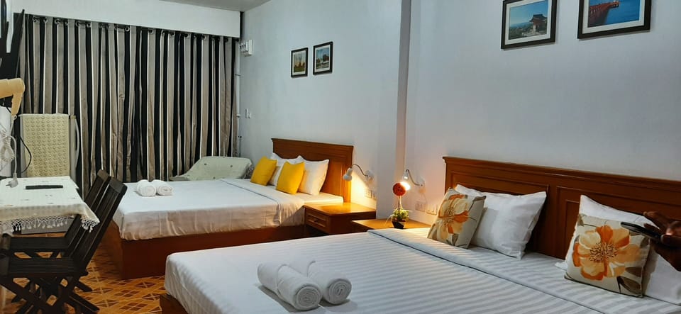 Family Quadruple Room | In-room safe, blackout drapes, free WiFi, bed sheets