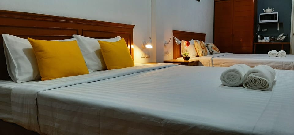Family Quadruple Room | In-room safe, blackout drapes, free WiFi, bed sheets