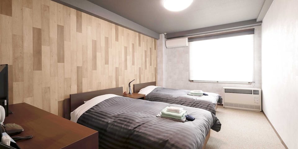 Standard Twin Room | Down comforters, in-room safe, blackout drapes, free WiFi