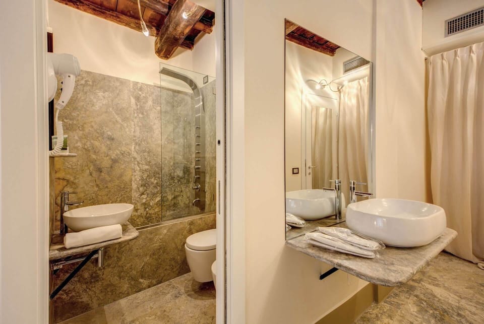 Shower, free toiletries, hair dryer, slippers