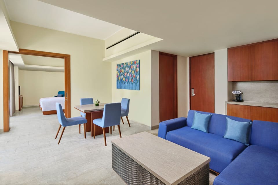 Suite, 1 King Bed, Pool View | Minibar, in-room safe, individually decorated, individually furnished