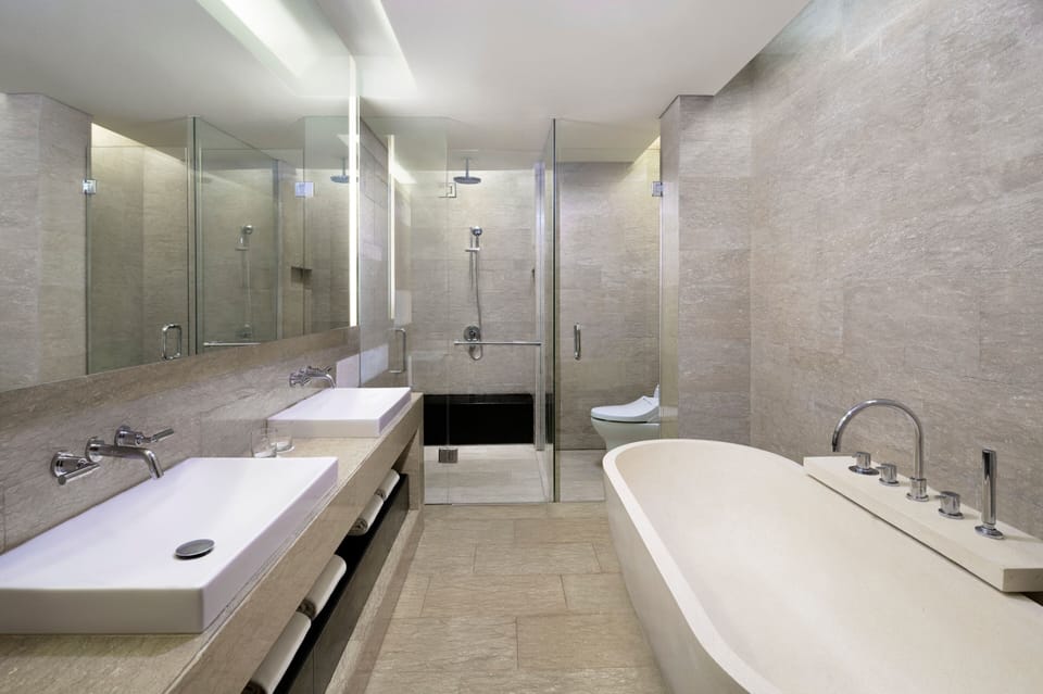 Suite, 1 King Bed, Pool View | Bathroom | Free toiletries, hair dryer, bathrobes, slippers