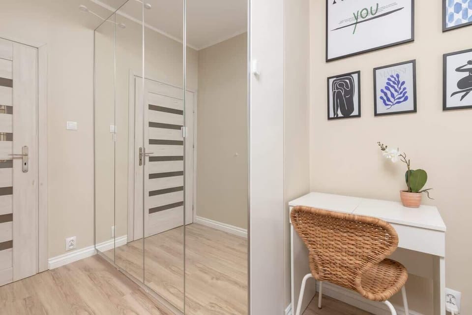 A spacious wardrobe with a mirror adds both storage and style to the bedroom.
