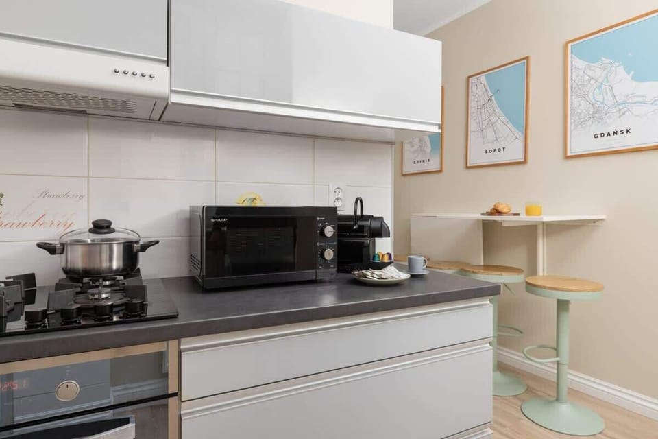 Prepare delicious meals in the modern kitchen with a gas stove and oven.