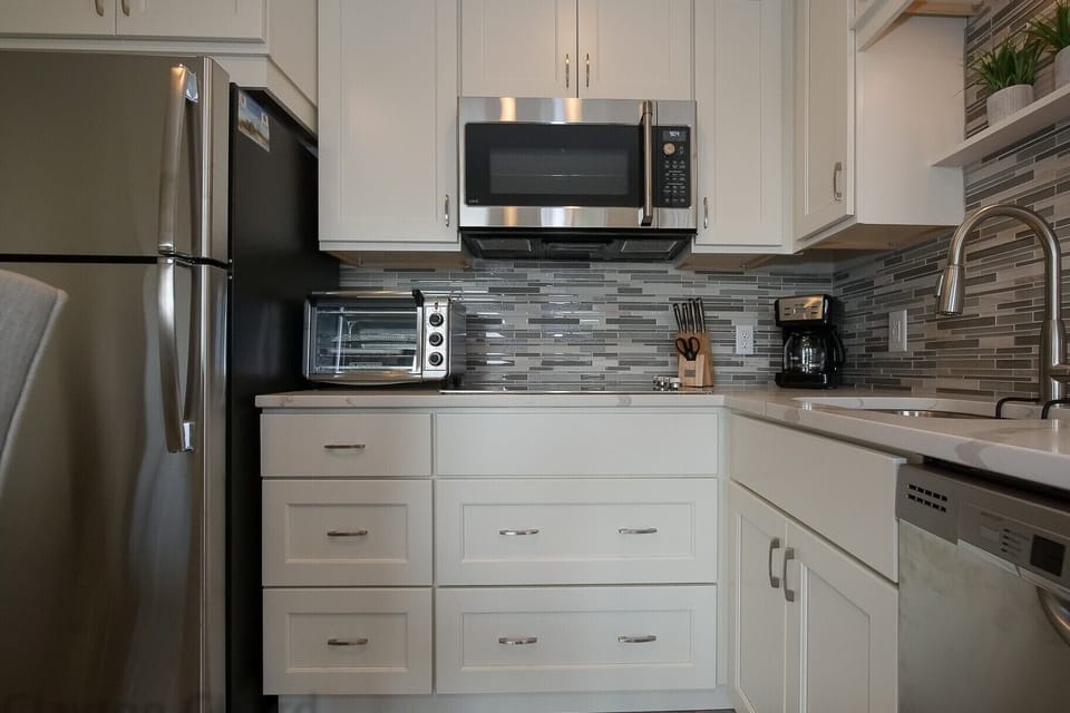 Carolina Beach Club 429 - Kitchen - Fully furnished kitchen with all new upgraded stainless steel appliance and beautiful tile backsplash. 
Lots cabinets space.