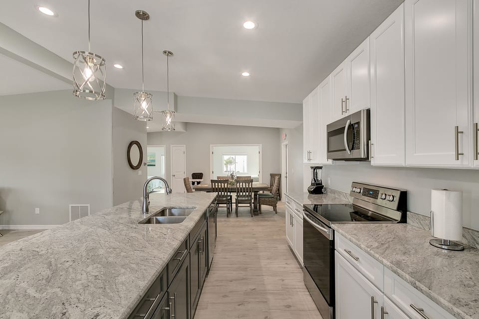 Spacious Granite Island has Lots of Room for Meal Prep.