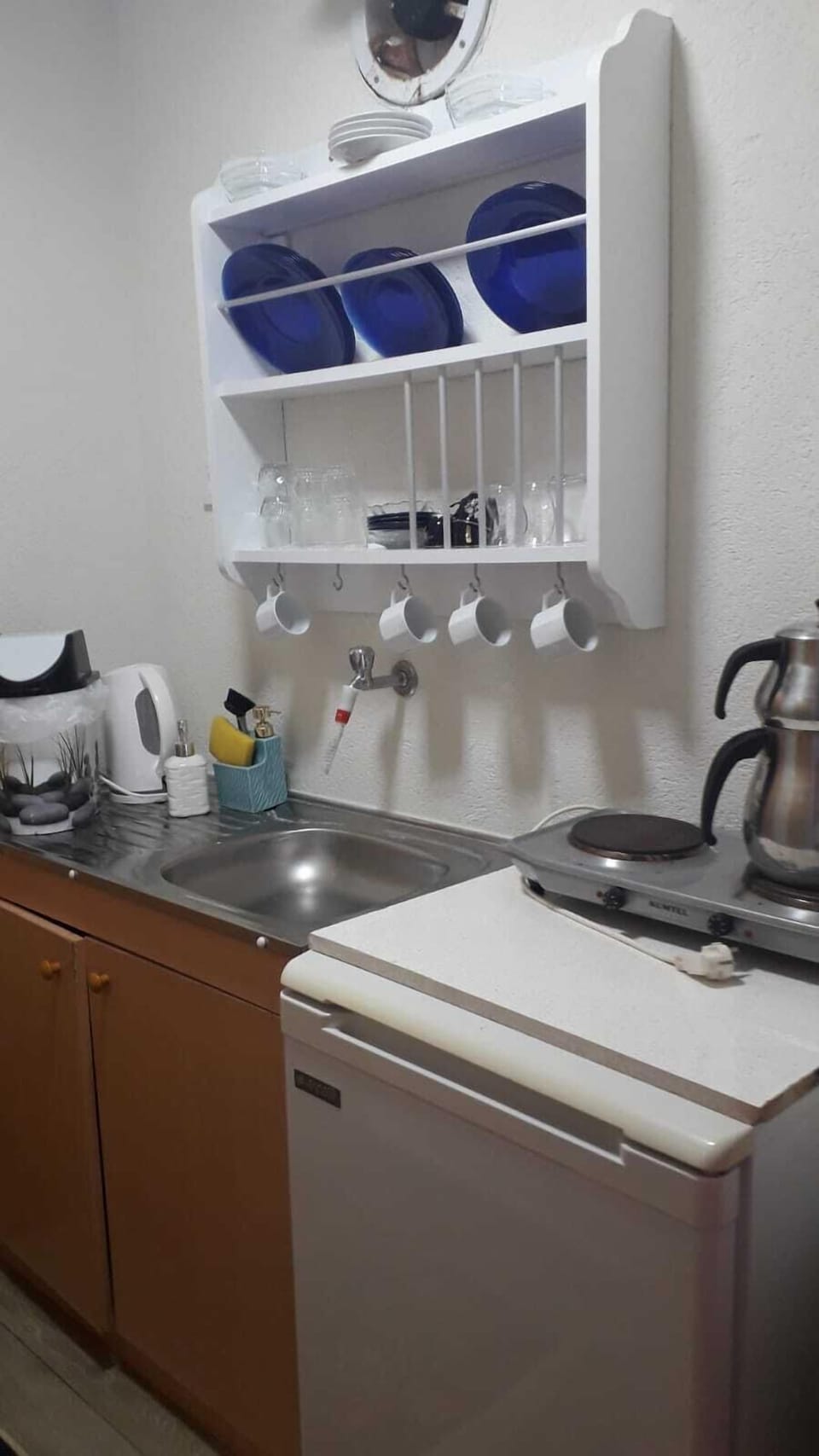 Fridge, stovetop, highchair, cookware/dishes/utensils