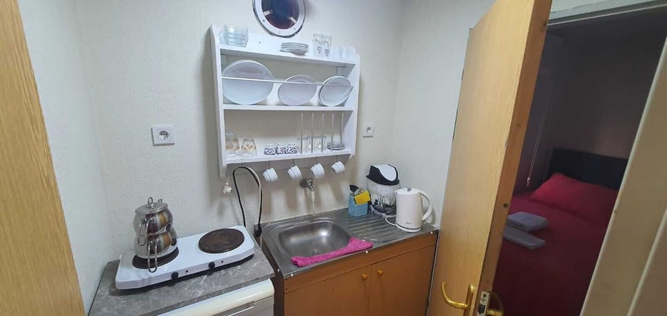 Fridge, stovetop, highchair, cookware/dishes/utensils