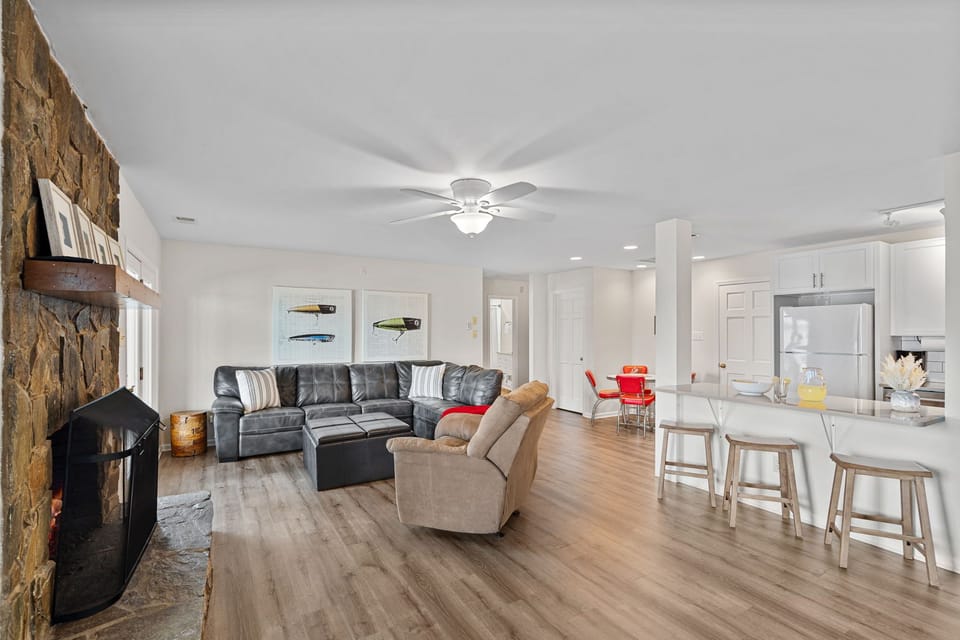 Lower level family room with plenty of seating, kitchenette & table for 4.