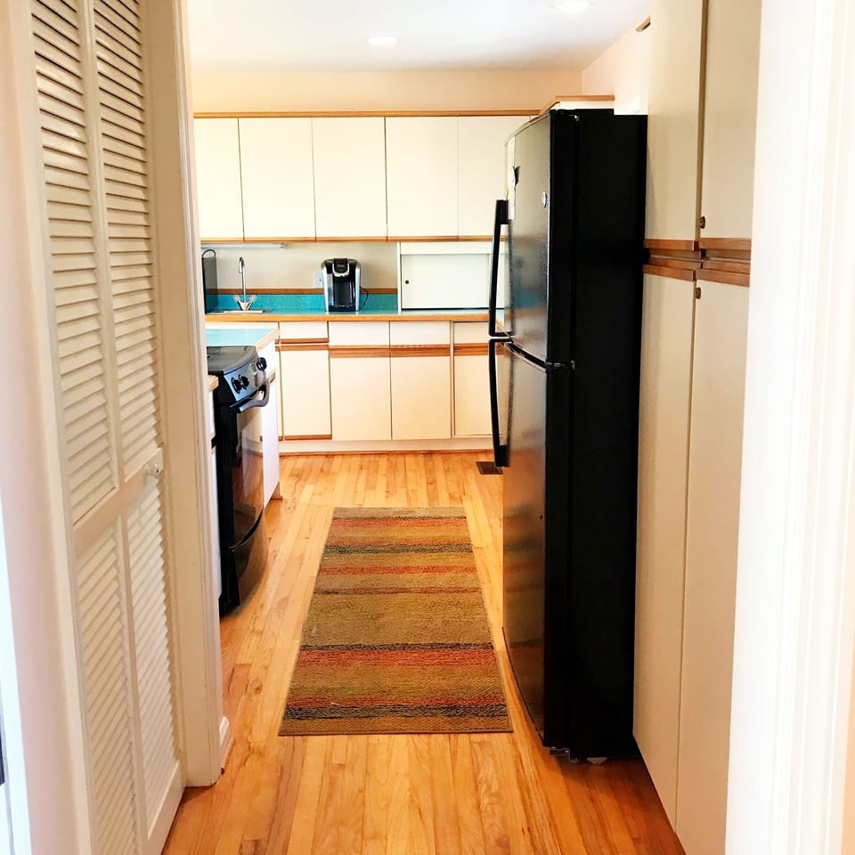 Entrance into the kitchen with pantry to the left.