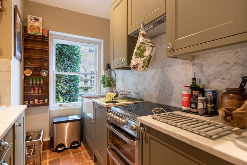 Small but functional kitchen with dishwasher and oven.