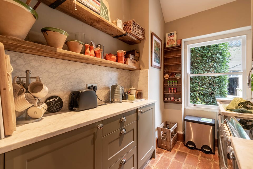 Small but functional kitchen with dishwasher and oven.