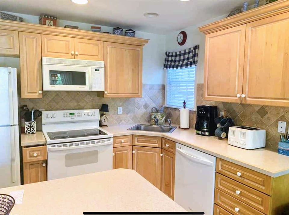 Fully stock kitchen with island bar.