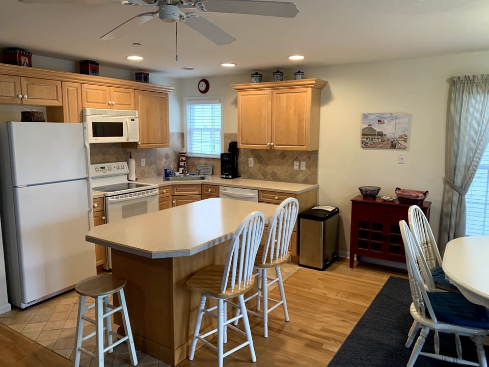 Fully stocked kitchen with island.