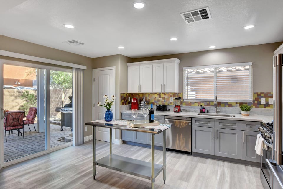 Kitchen with toaster, blender, K-cup coffee maker,  coffee pods and cream, sugar