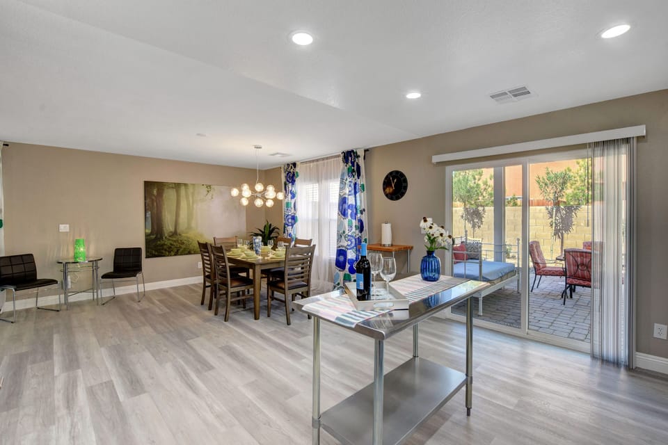 Dining area and kitchen has a sliding glass door to the backyard