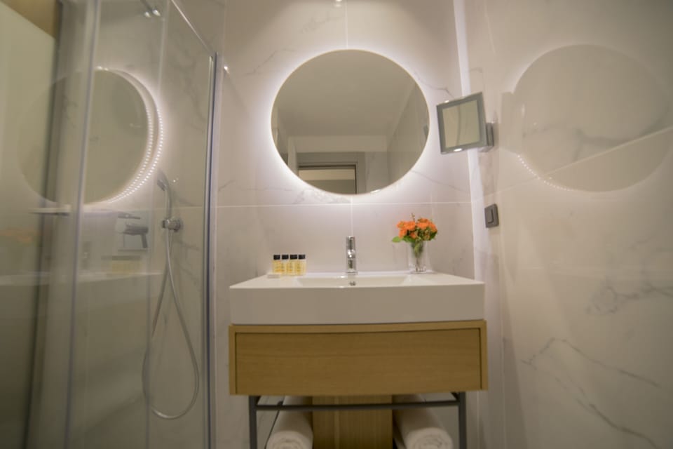 Shower, rainfall showerhead, designer toiletries, hair dryer