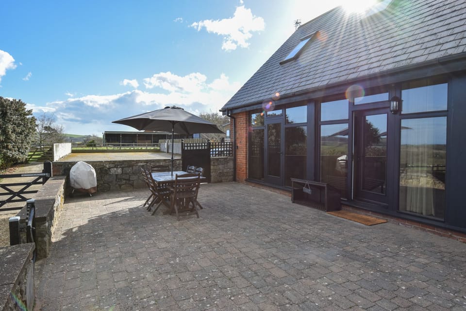The private patio area offers 360-degree panoramic views of the Isle of Wight countryside and Ashey Downs.