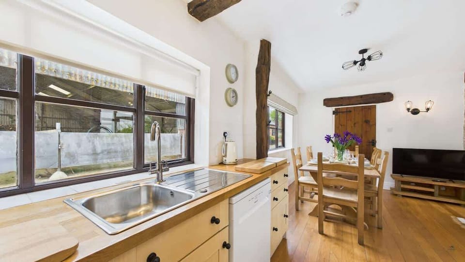 Thoughtfully stocked for a self-catering farm stay, featuring ample counter space and high-end small appliances.