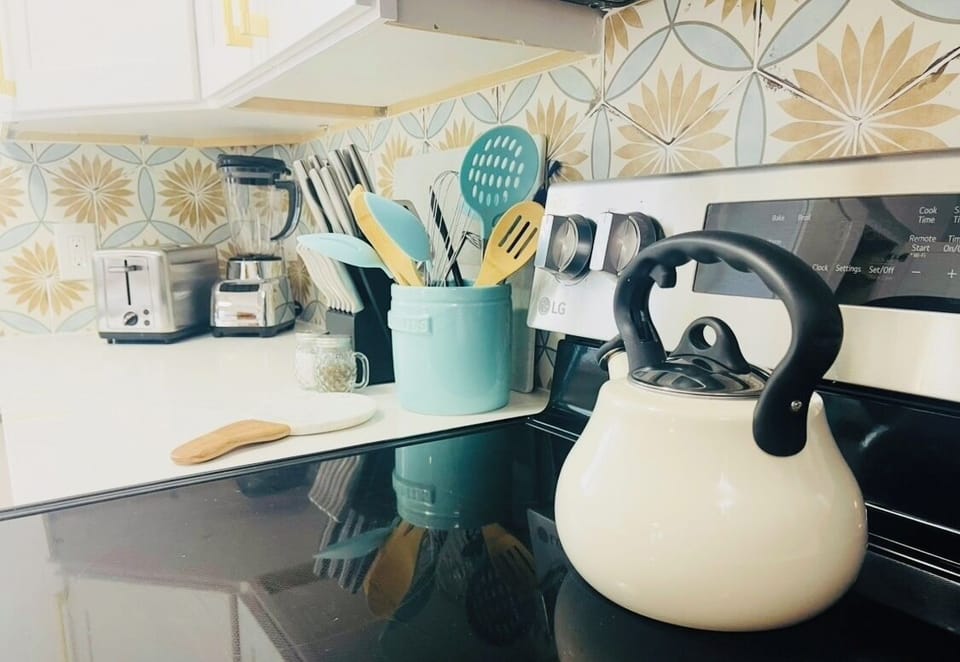 All kitchen necessities, kettle, blender, toaster, knives and utensils.
