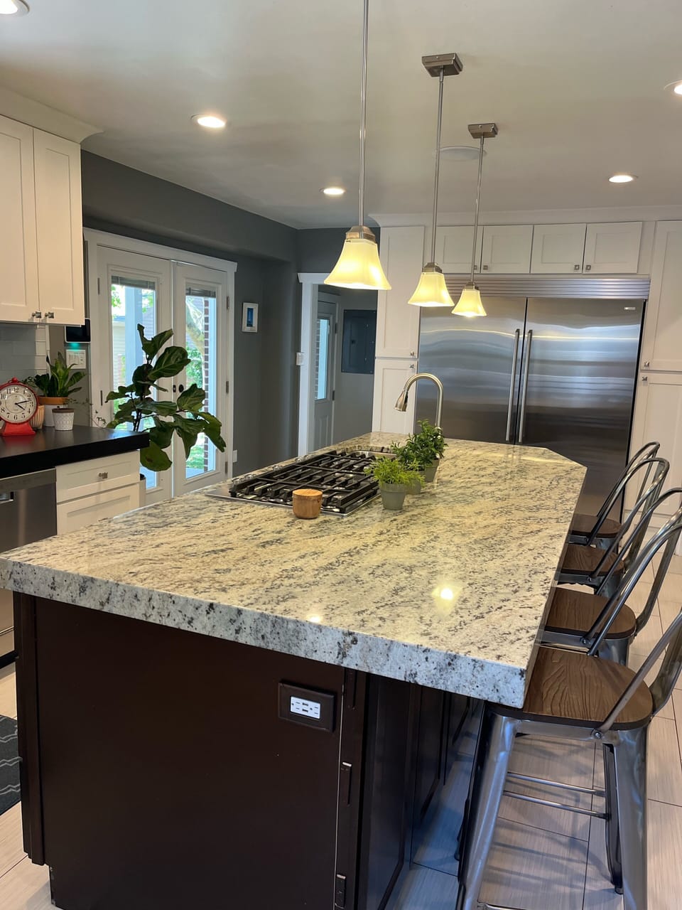 Kitchen with large fridge and freezer. 
