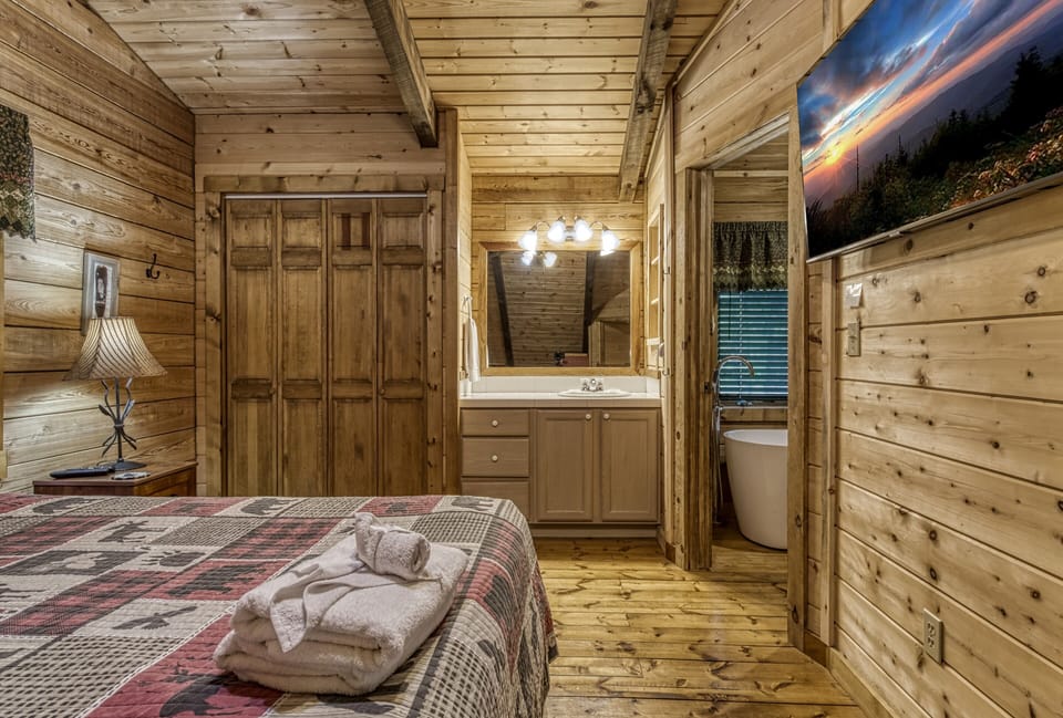 Pet Friendly Vacation Rental in Pigeon Forge - Cedar Lodge - Upper level bedroom three with 50-inch TV