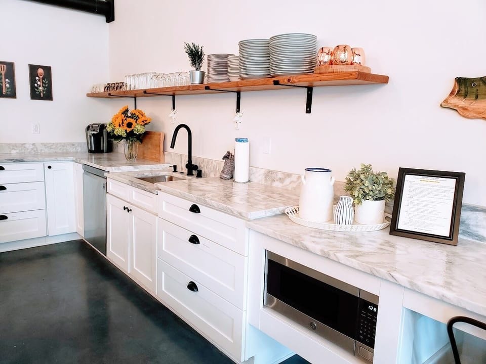 Beautiful and modern kitchen with stainless steel appliances.